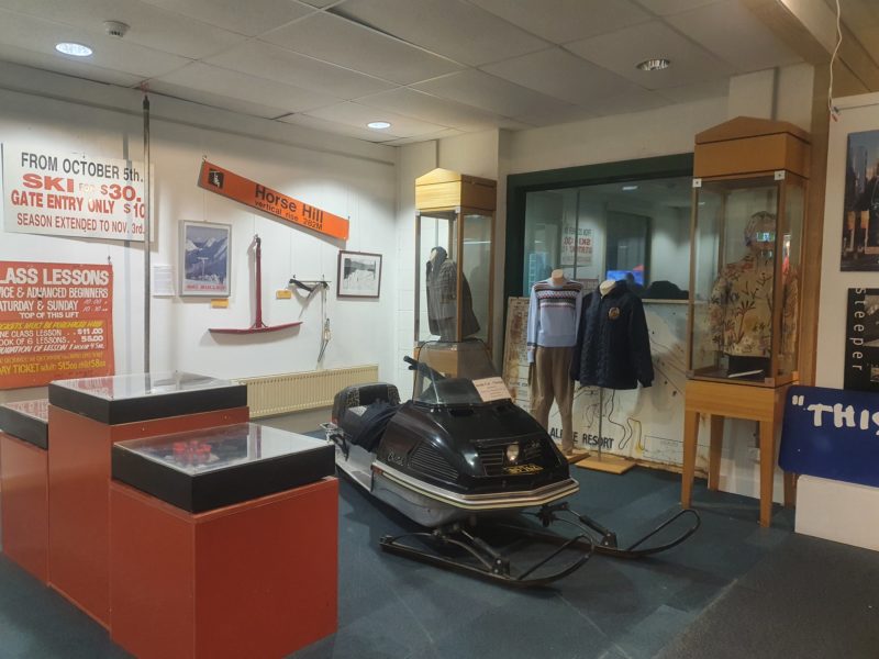Museum gallery with various winter artefacts on display