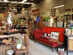 Obtainiam Antiques and homewares interior, antique red couch and stalls
