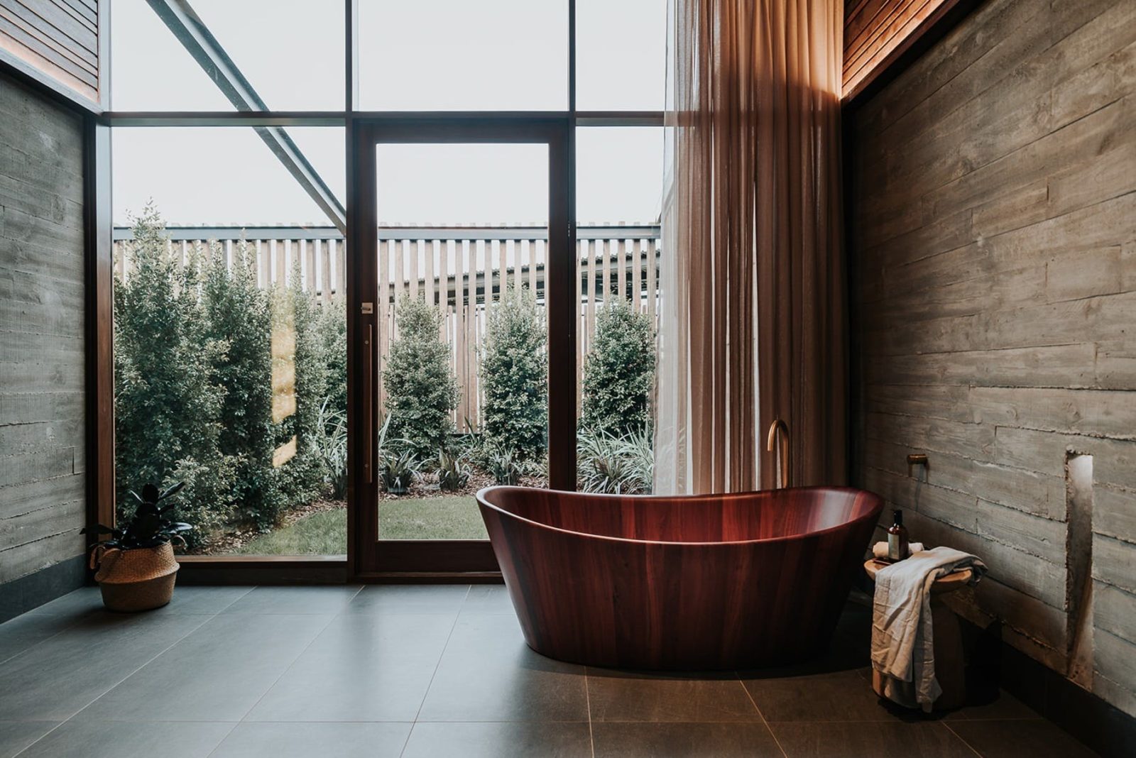 Treatment room featuring stunning red wood bath