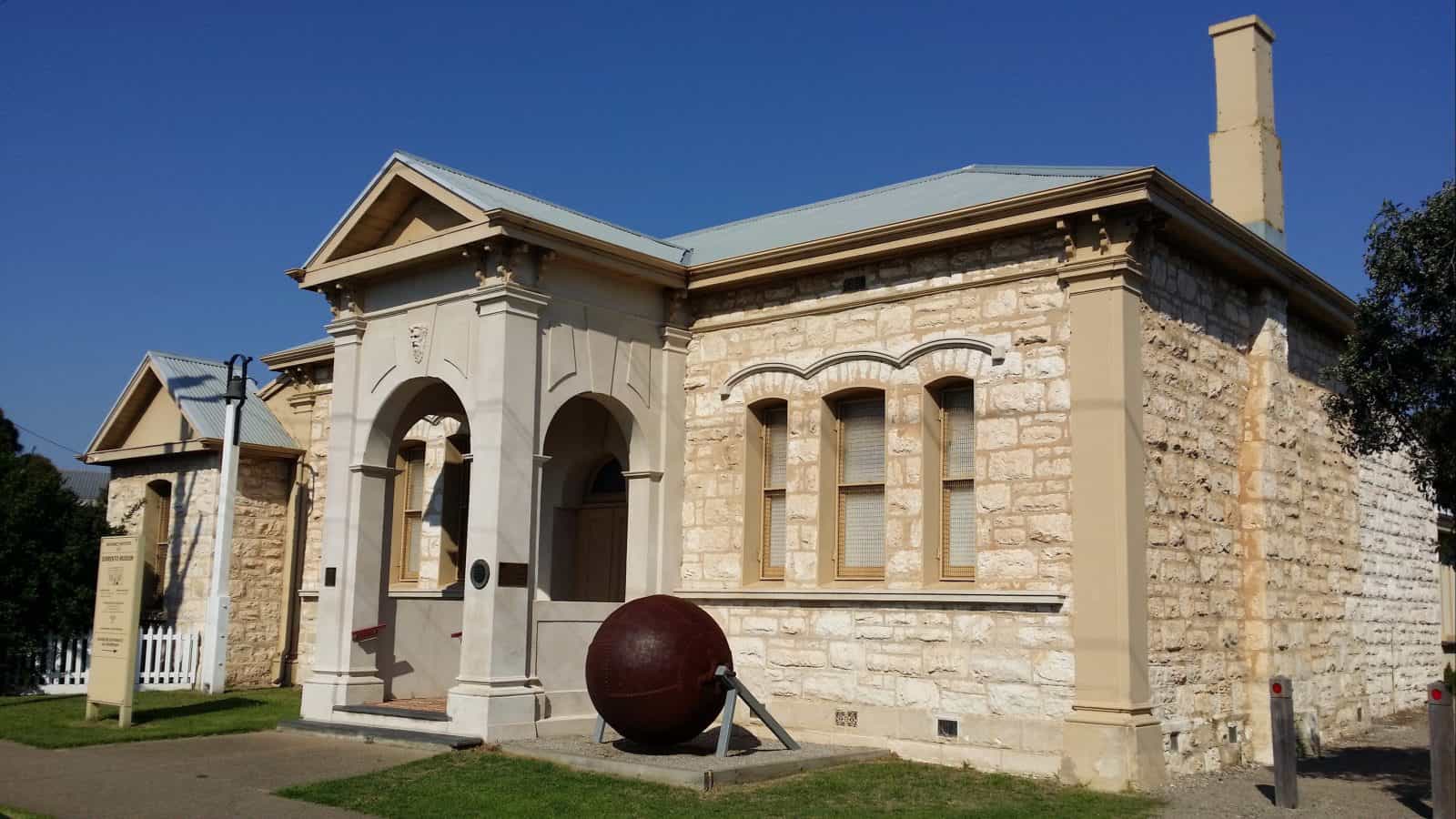 Sorrento Museum, a limestone building with a steel ball outside to the right of the door