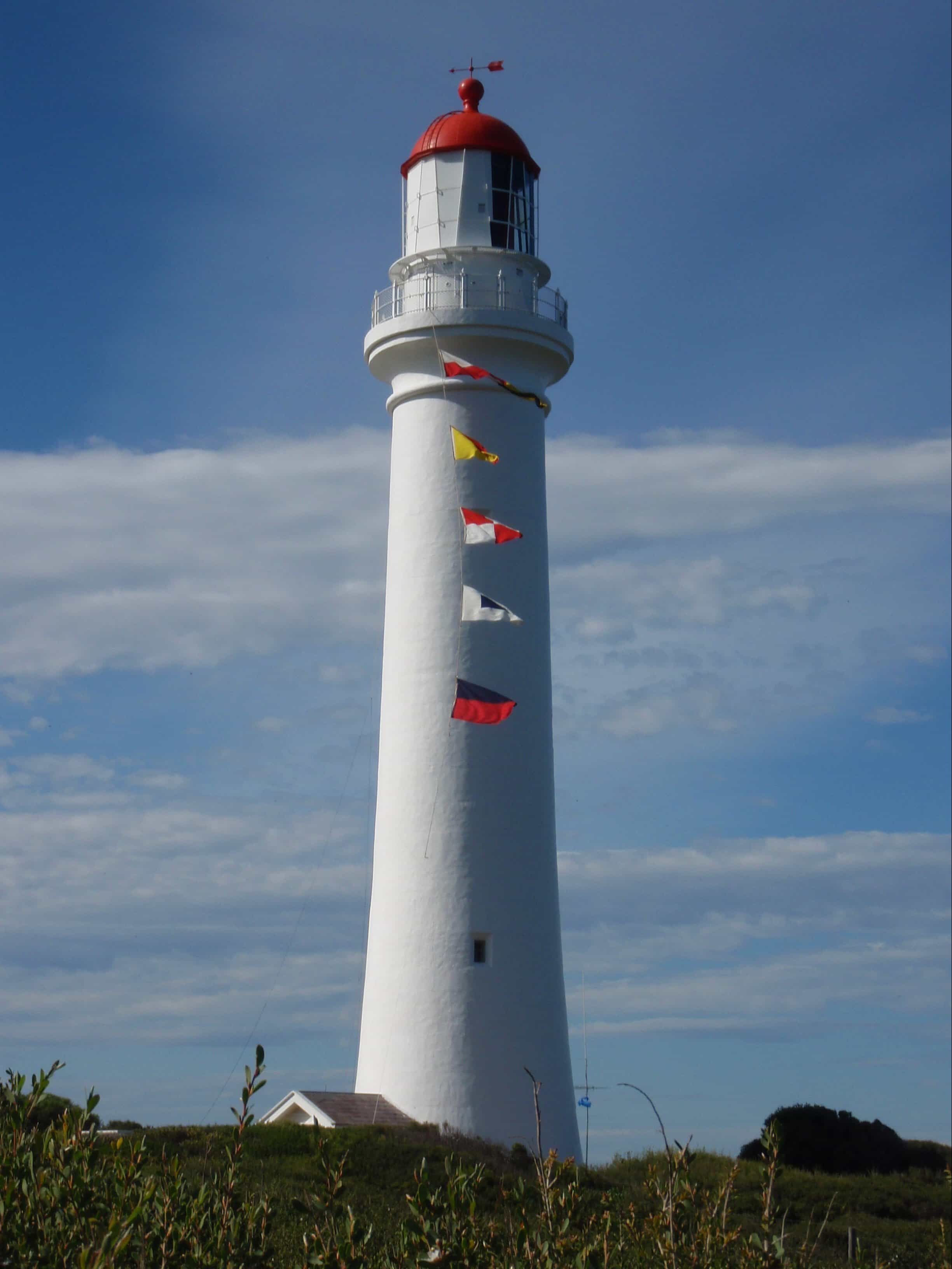 A full view of Split Point Lightouse on International Lighthouse Weekend with signal flags flying