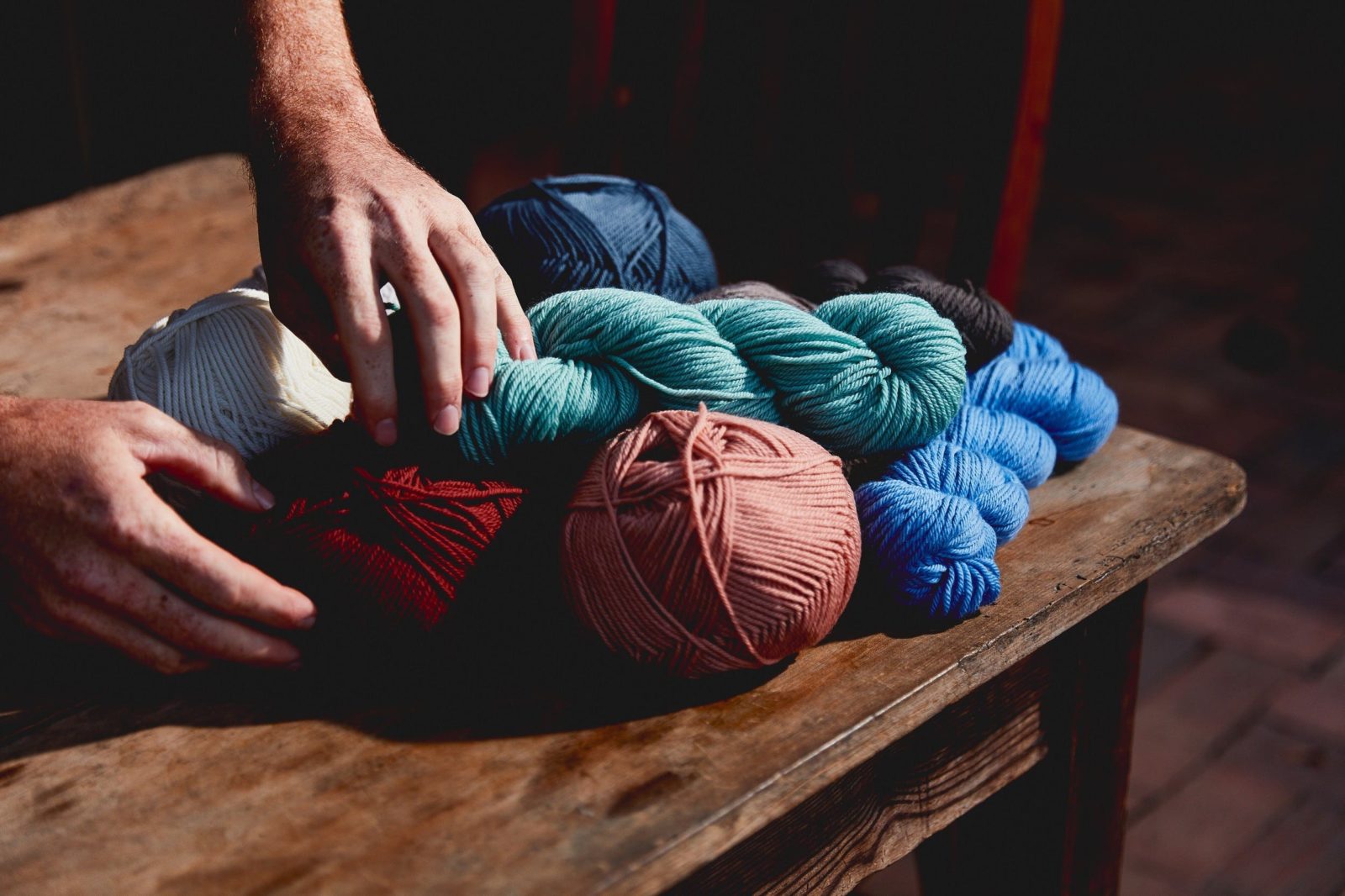 coloured knitting yarn on a table