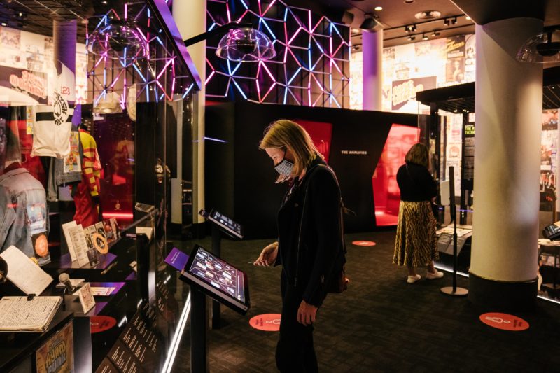 Visitor interacting with the Australian Music Vault free exhibition digital panels