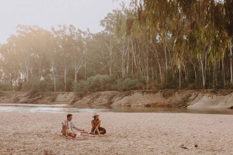 Couple enjoying a picnic at Thompson's Beach