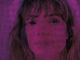 Nicole Gunn's face with a French actor's face overlayed, with a bright pink effect