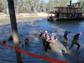 Swimmers leaving the Murray River