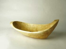 Carved canoe-shapped vessel