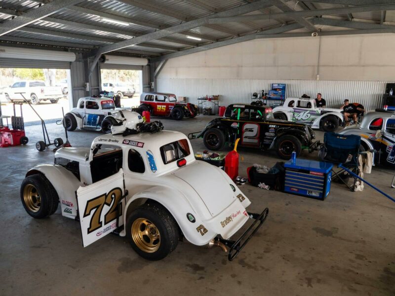 Garage with six legend cars cooling after a race event