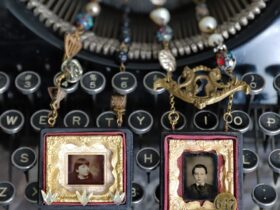 Two necklaces resting on typewritter keyboard