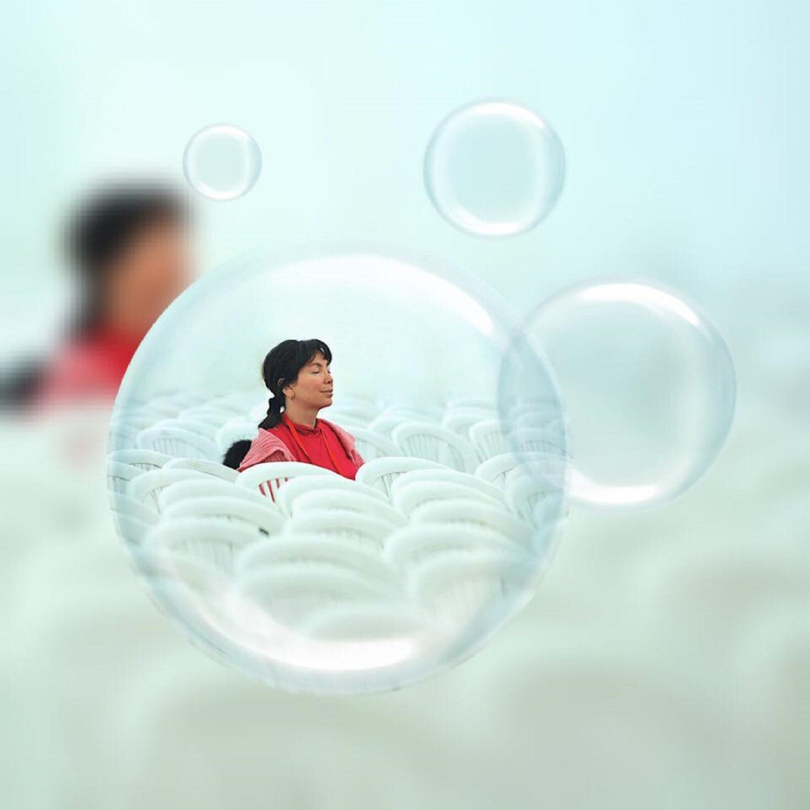 Lady meditating with bubbles