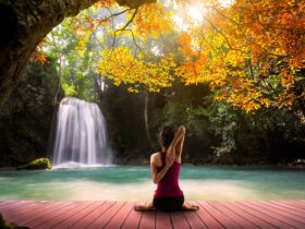 Lady Meditating At Waterfall