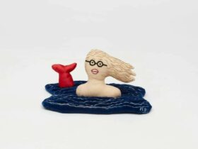 Artist Adrienne Doig depicted as a fabric goddess doll