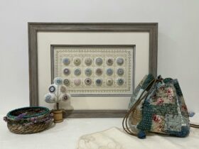 Embroidery in a frame with items in front