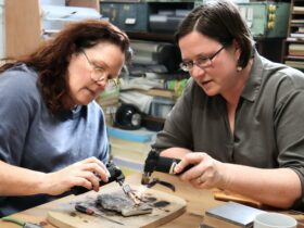 Sarah and student heating up a ring for soldering in our Silver Jewellery Workshop