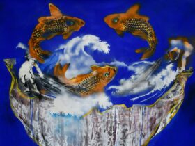 goldfish leaping on bright blue background