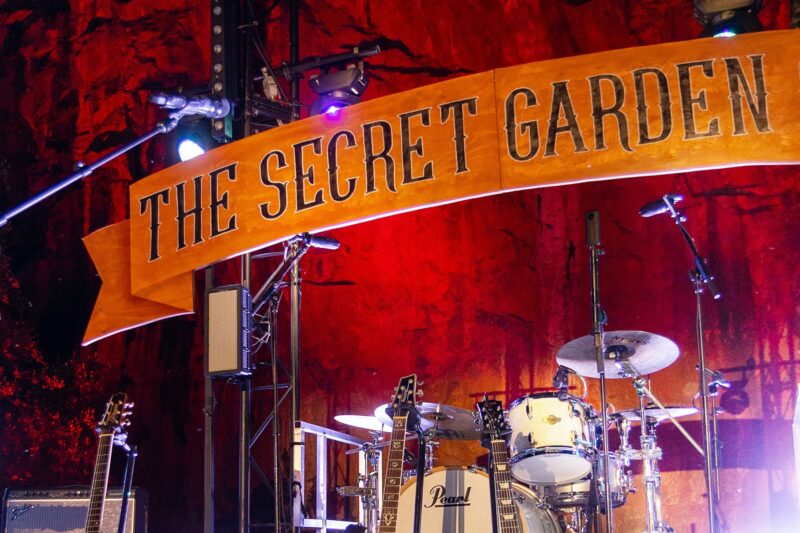 The Secret Garden Gig Stage - Showing the banner, an array of instruments and the Quarry