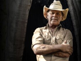 Image of Troy Cassar-Daley in a cowboy hat with arms crossed