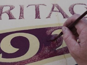 Close up of hand painting a sign