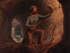 A miner in a tunnel finds a large gold nugget