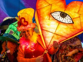 A colourful lady holds an amazing homemade lantern