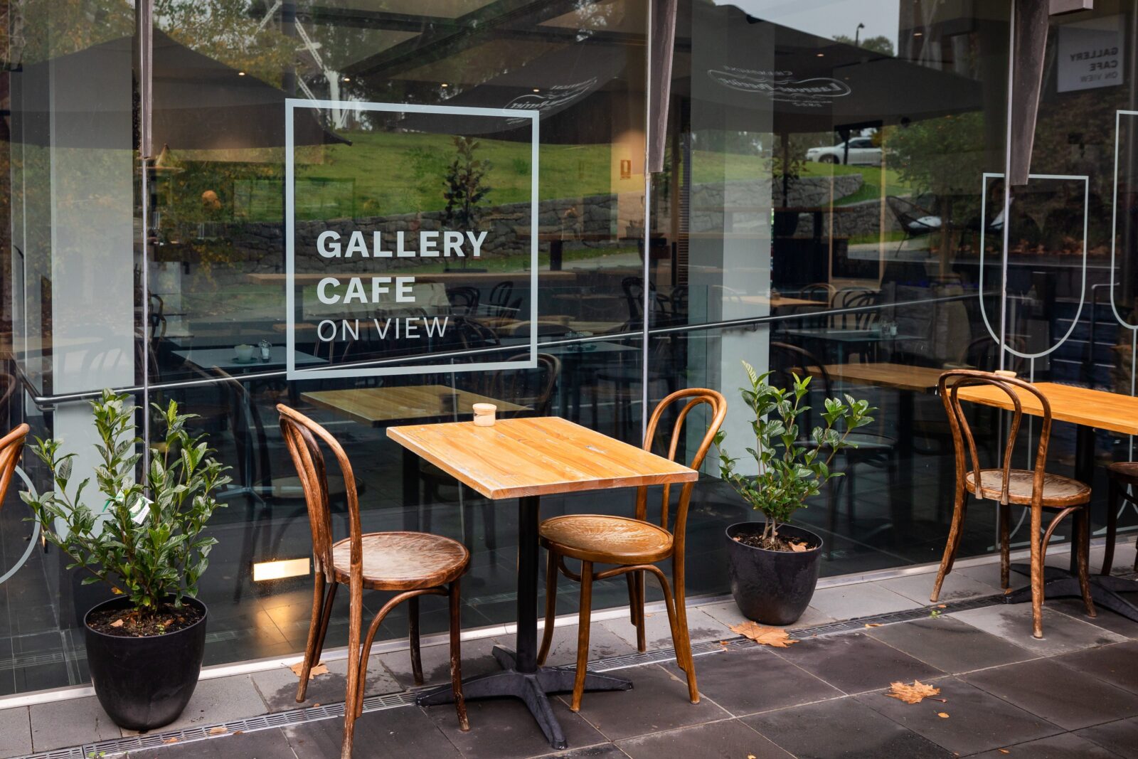 Outdoor seating in front of window that says Gallery Cafe on View