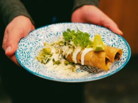 Better known as golden taco (dorados) from Hidalgo: Steamed Lamb+ sour cream +cotija cheese + avo.