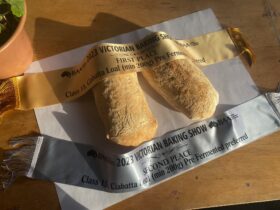Two ciabatta loaves with a gold and a silver award ribbon