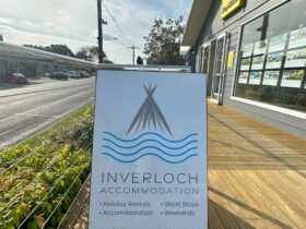 Inverloch Accommodation A-frame sign in front of office on Williams Street