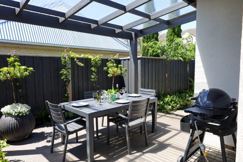 Undercover outdoor dining setting with BBQ