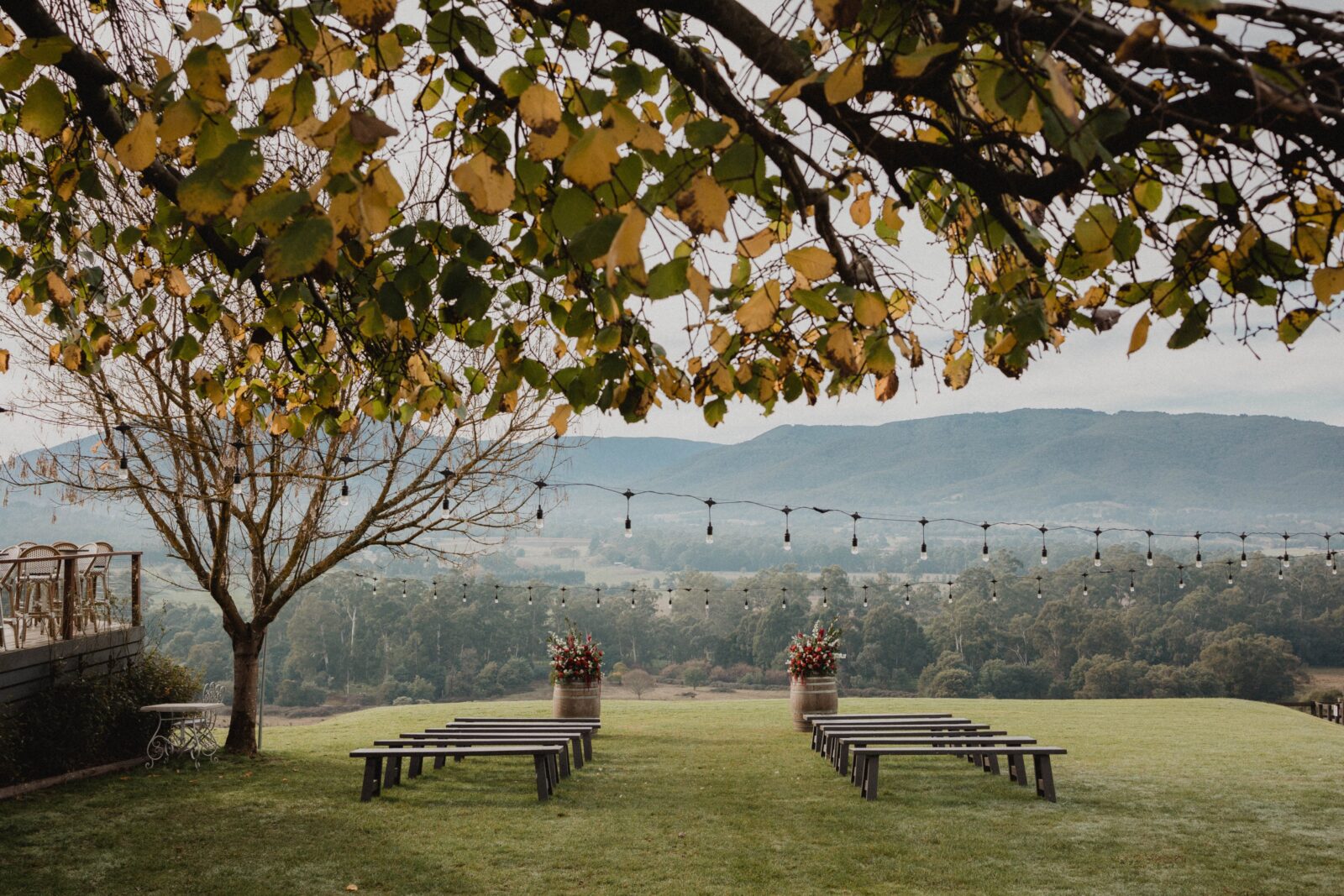 A ceremony set-up on The Riverstone Estate's lawn during autumn.