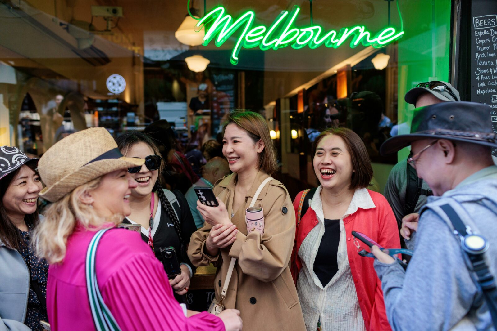 Melbourne visitors enjoying a moment outside a famous Melbourne cafe laneway