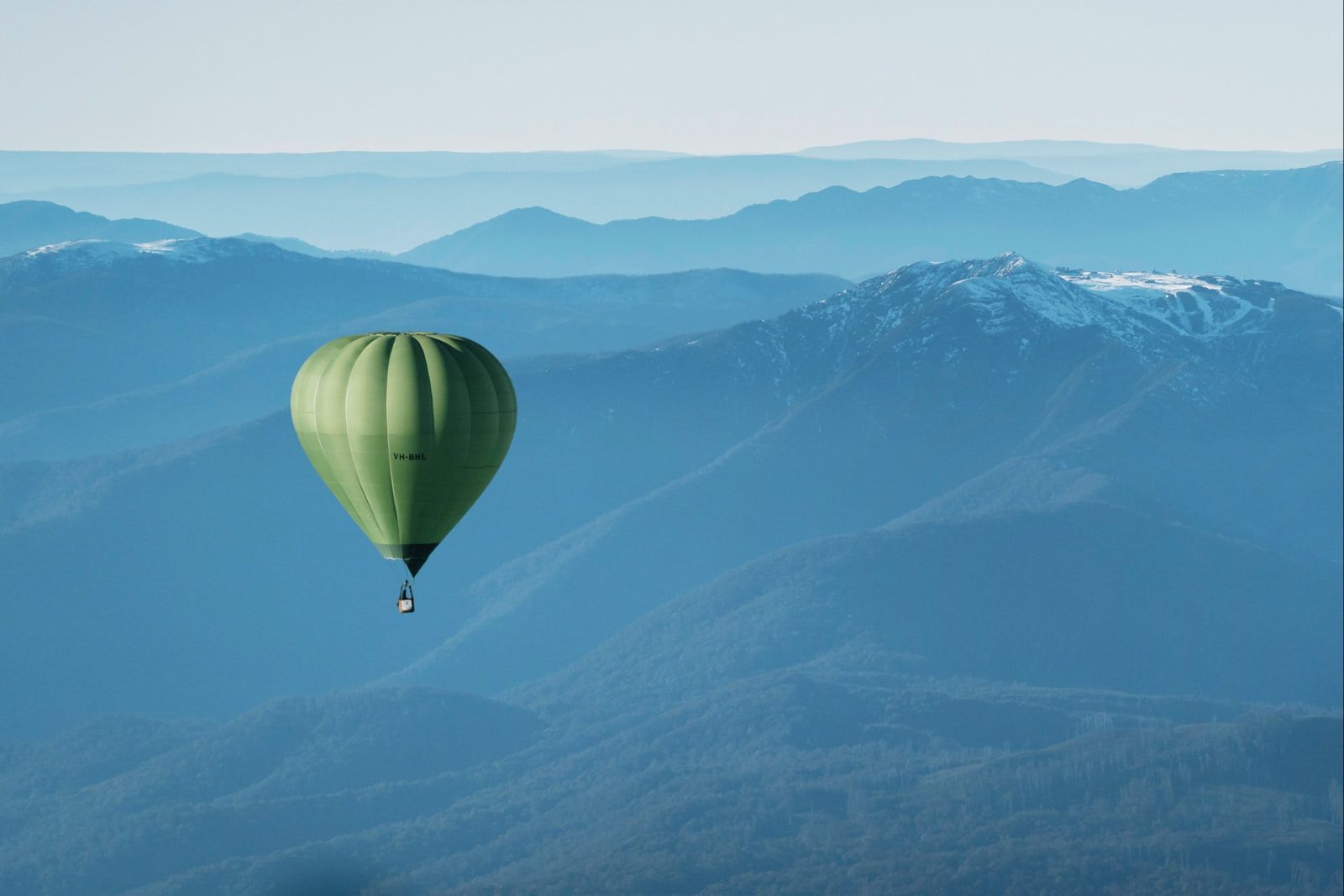 Green Hot Air Balloon Over Mansfield - Mt Buller in the Background
