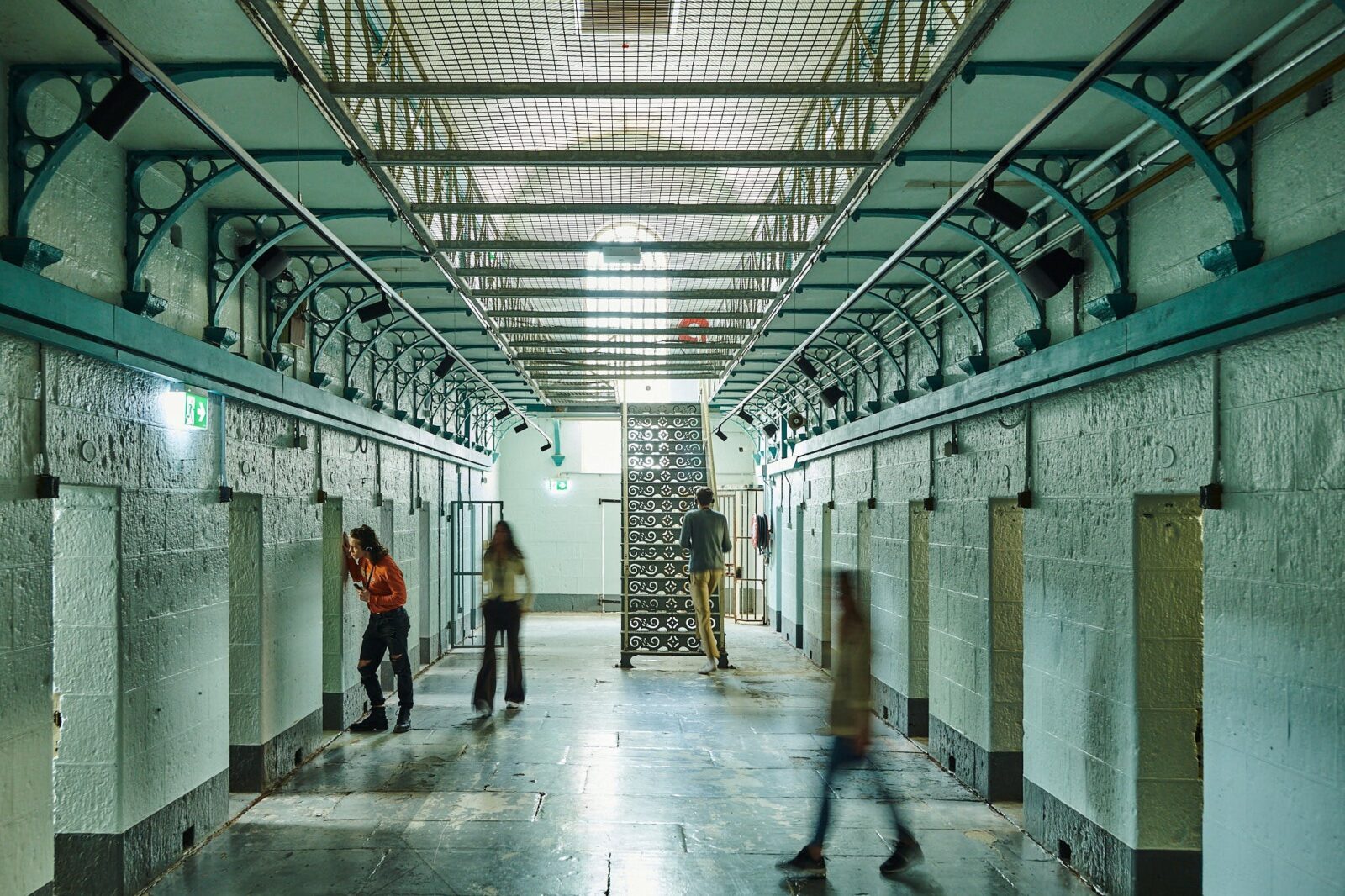4 visitors exploring in H Division at Pentridge Prison Tours
