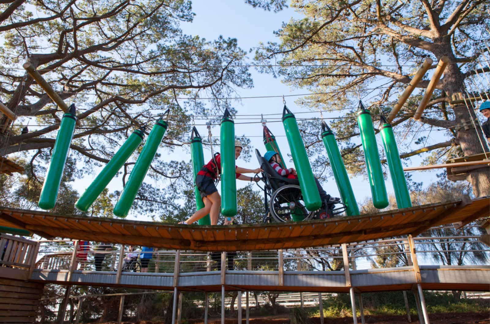 Image: person in wheelchair enjoing accessible high ropes course