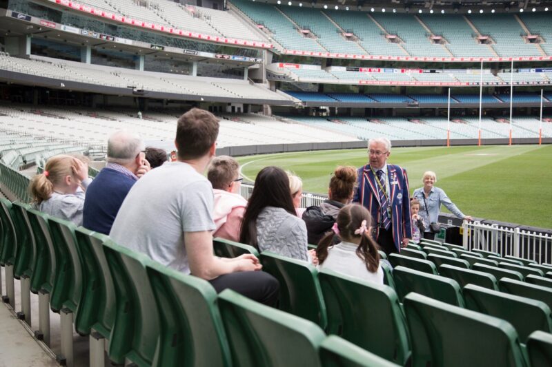 MCG Tour guide with guests