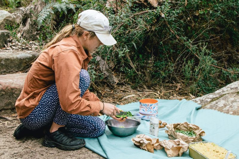Guide preparing organic plant-based lunch on the Grampians Peaks Trail