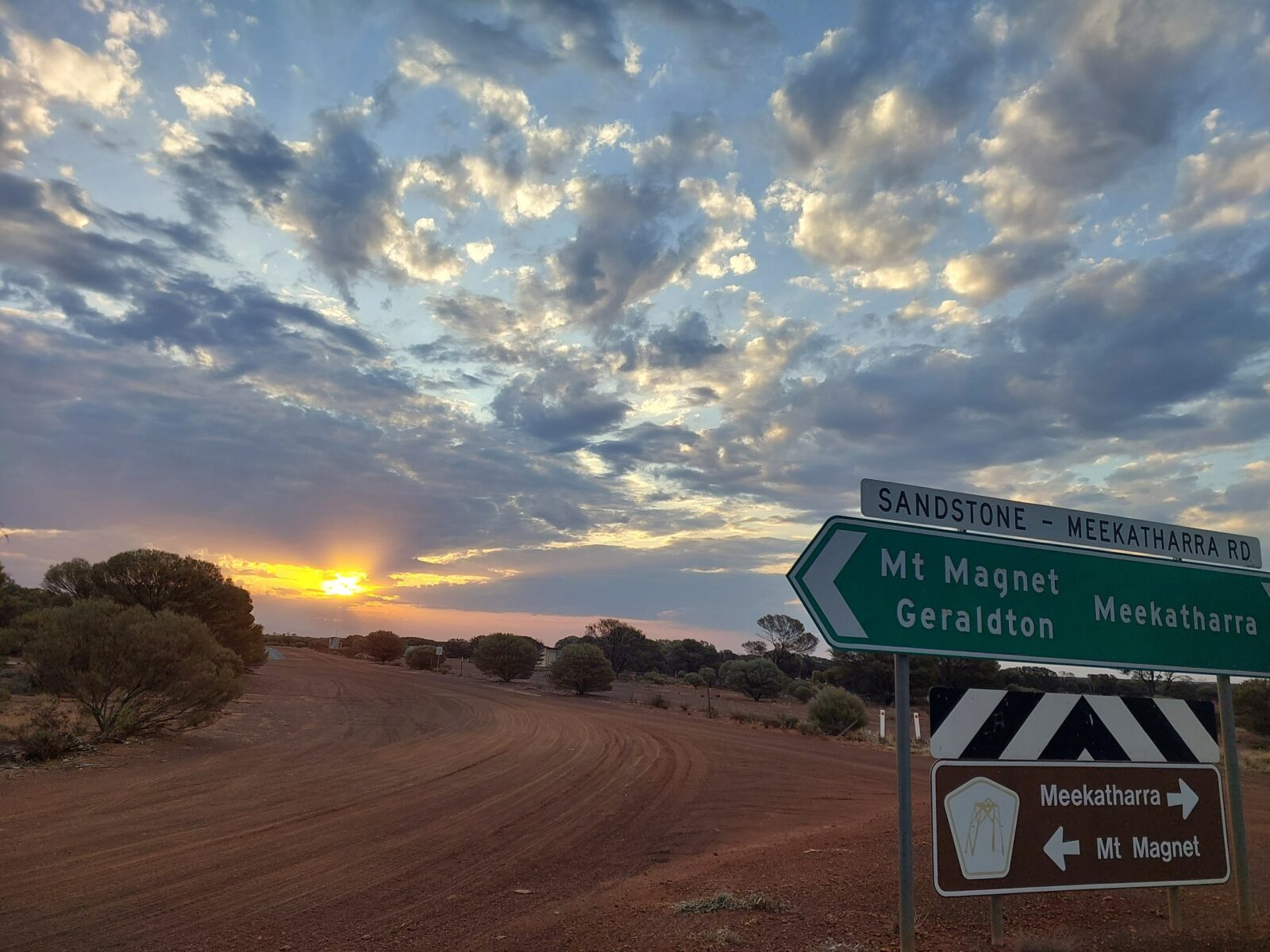sunset behind sign