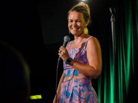 comedian on stage with mic