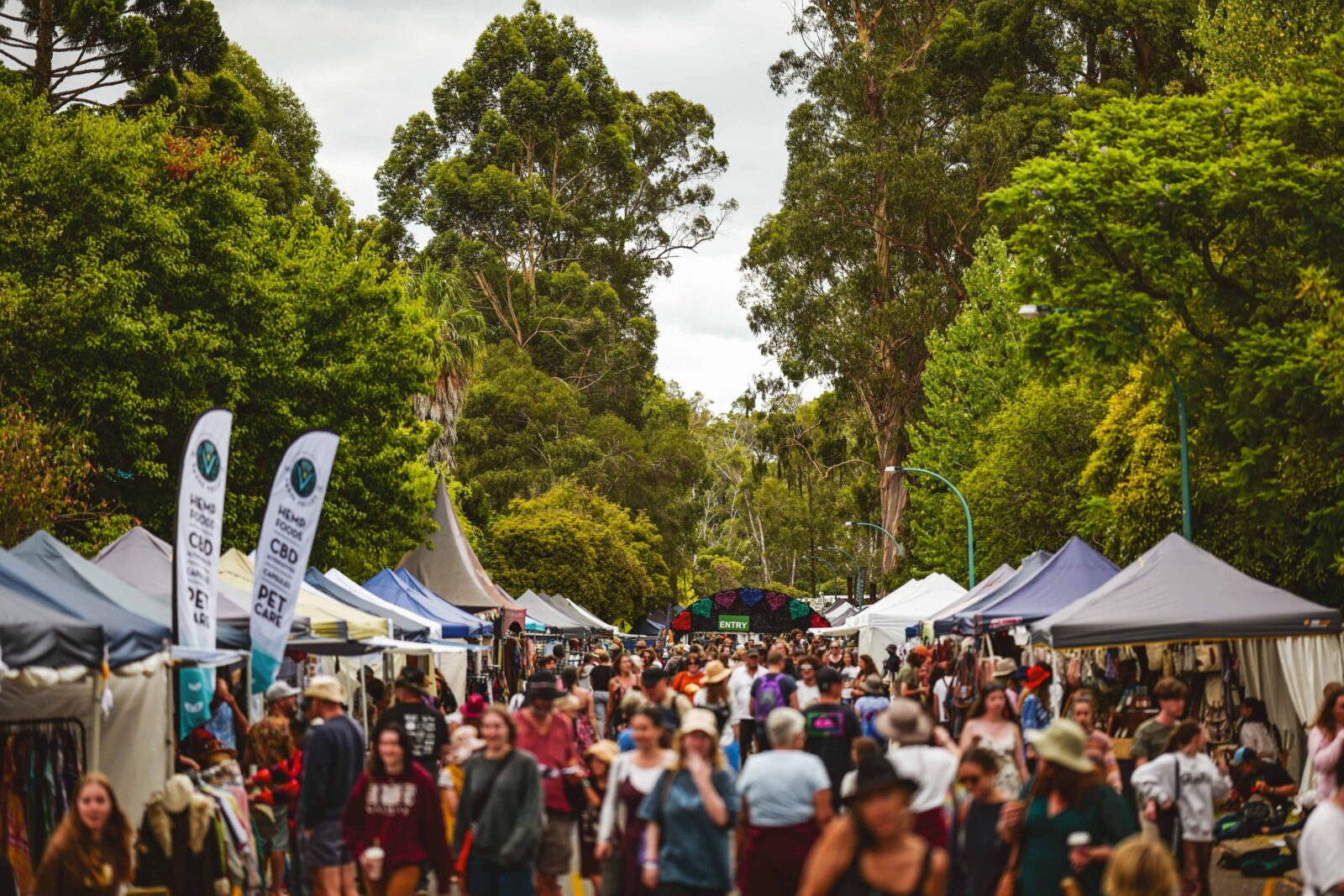 Street view of the 2023 Nannup Music Festival, full of people and market stalls.