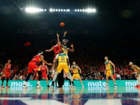 Perth Wildcats players tip-off against the Tasmania JackJumpers