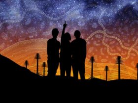 Image of a milky way and three silhouettes pointing to the sky with an indigenous pattern