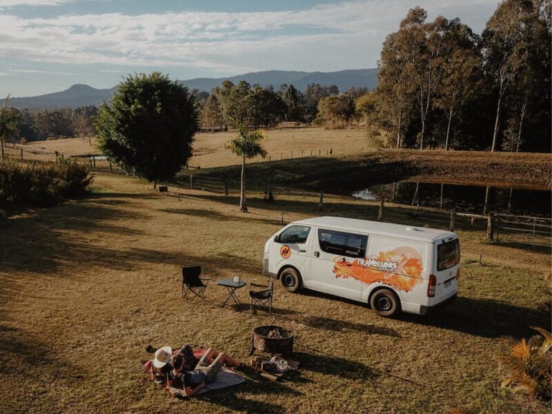 Chubby Campervan with people laying next to it