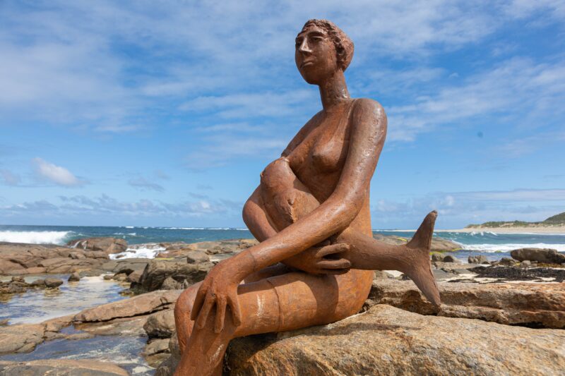 Mermaid statue on beach